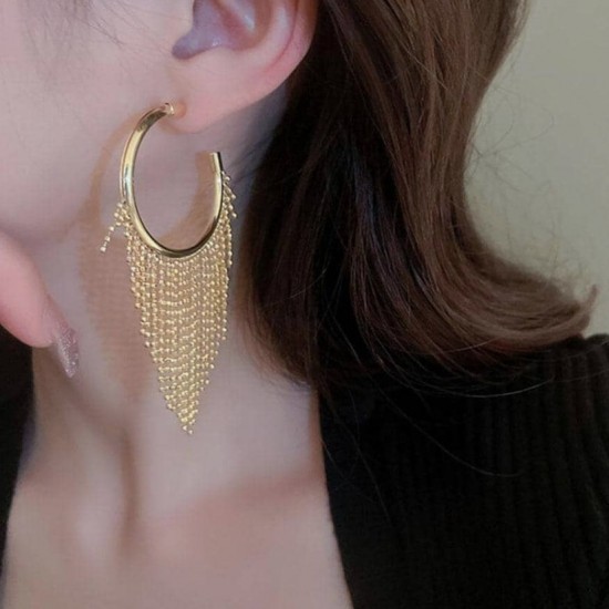A close-up photo of a hand holding a pair of gold hoop earrings with delicate fringe chains. Fashion Tassel Design Hoop Earrings For Women|image