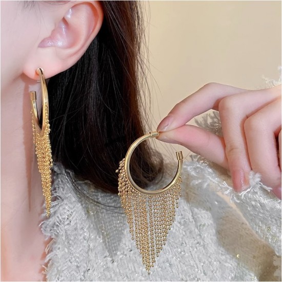 A close-up photo of a hand holding a pair of gold hoop earrings with delicate fringe chains. Fashion Tassel Design Hoop Earrings For Women|image