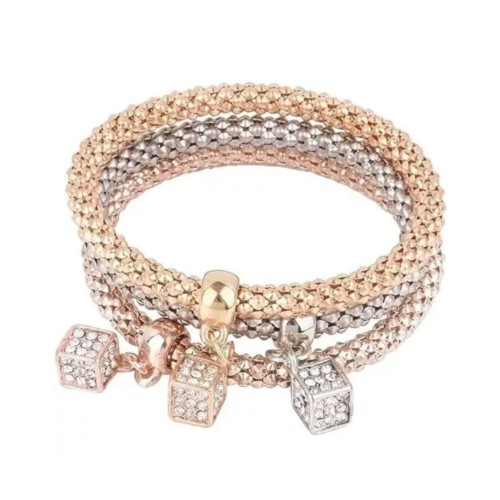 Three interconnected bracelets in gold, silver, and rose gold, each with a dangling crystal cube charm.