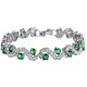 A beautiful silver bracelet with emerald green crystals and clear crystals set in a wavy pattern.