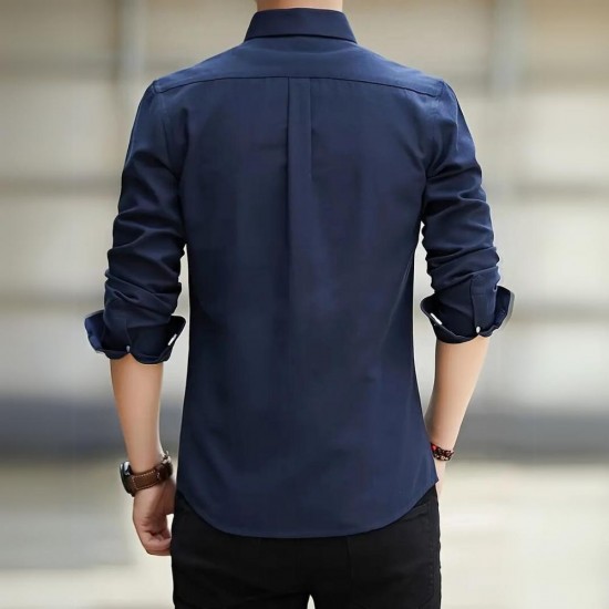 Male model wearing a lightweight, long-sleeve oxford shirt in a casual setting Men's Long Sleeved Casual Thin Oxford Shirt - Navy Blue |image
