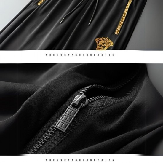 Men's Black Versace tracksuit modeled on a man, featuring a gold medusa logo embroidered on the chest. Luxury Style Men's Black & Gold Tracksuit |image