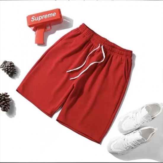 Â A male golfer wearing lightweight, stretch chino golf shorts in a relaxed swing position on a sunny golf course in Dubai Men's Golf Shorts Stretch Chino Lightweight Half Pants - Red |image