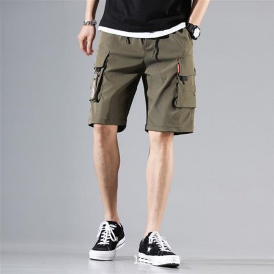 Male model wearing trendy cargo shorts with multiple pockets, showcasing a stylish and functional summer outfit. Men's Trendy Cargo Shorts With Multi Pocket - Green |image