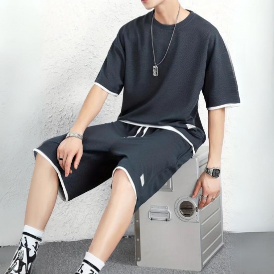 Male model wearing a men's waffle knit sports set, showcasing a comfortable and stylish outfit. Men's Waffle Knit Tracksuit Set Relaxed Summer Style - Navy Blue |image