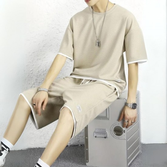 Male model wearing a men's waffle knit sports set, showcasing a comfortable and stylish outfit. Men's Waffle Knit Tracksuit Set Relaxed Summer Style - Biege |image