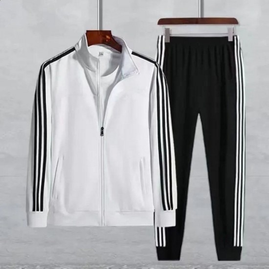 Male model wearing a White tracksuit with white stripes on the sleeves and legs. Men's White Tracksuit with Black Stripes Sporty & Stylish |image