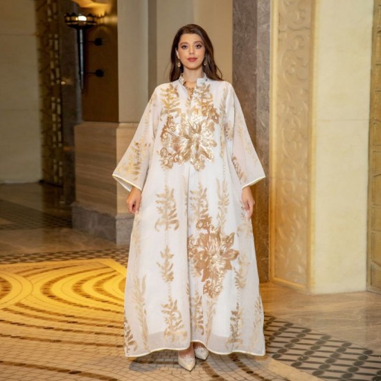 A woman wearing a relaxed, V-neck kaftan with vibrant color contrast embroidery and regular sleeves, perfect for a casual day out in Dubai. Casual V-neck Color contrast Embroidery Regular sleeve Maxi Dress - White |image